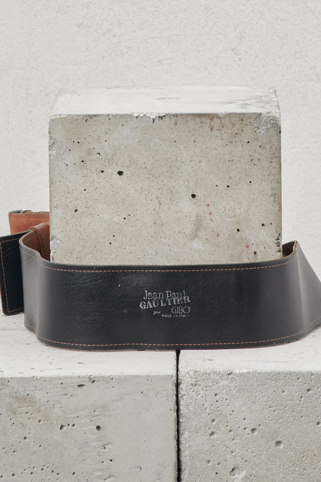 Brown leather belt with metal buckle