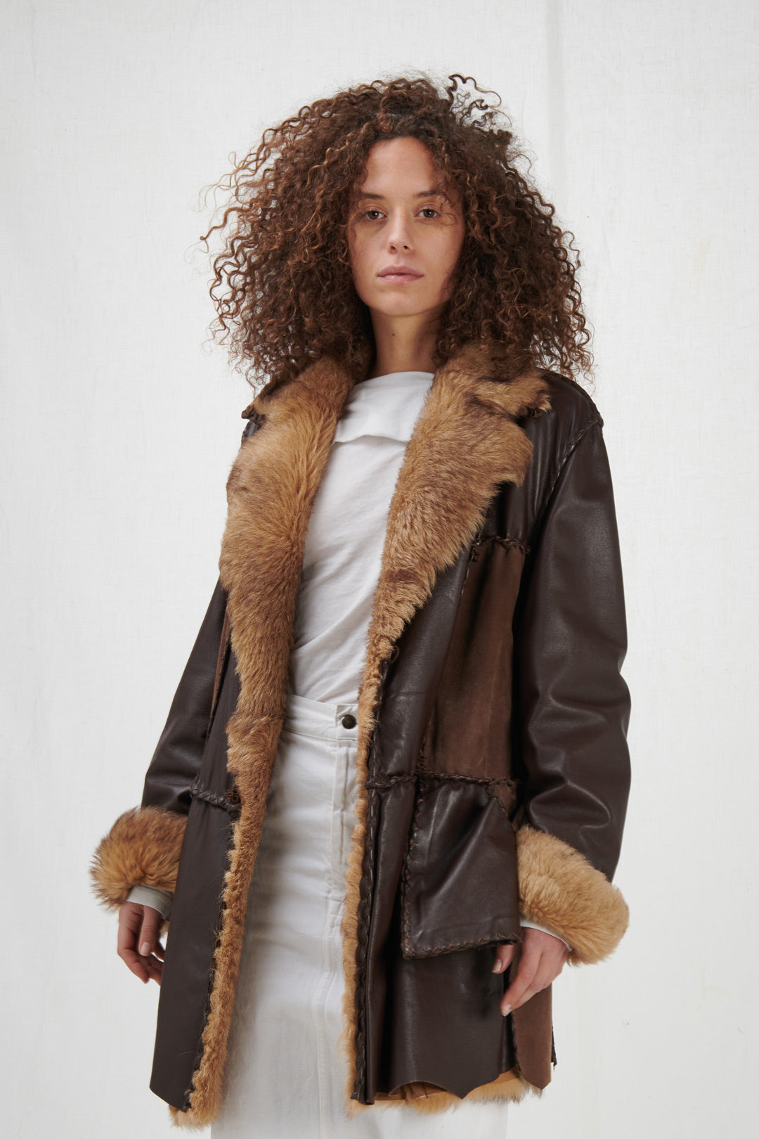 OUTERWEAR IN BROWN LEATHER AND FUR