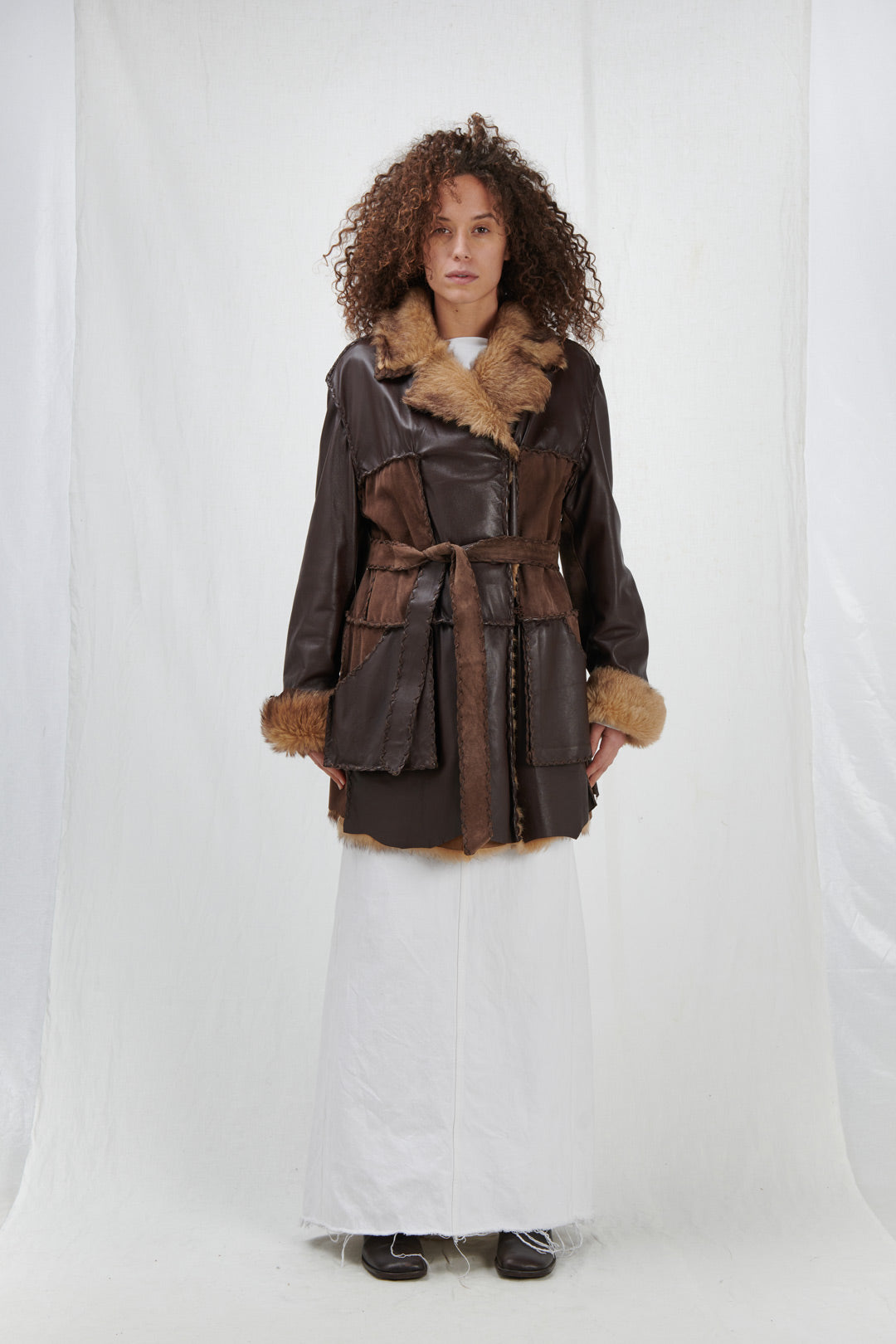 OUTERWEAR IN BROWN LEATHER AND FUR