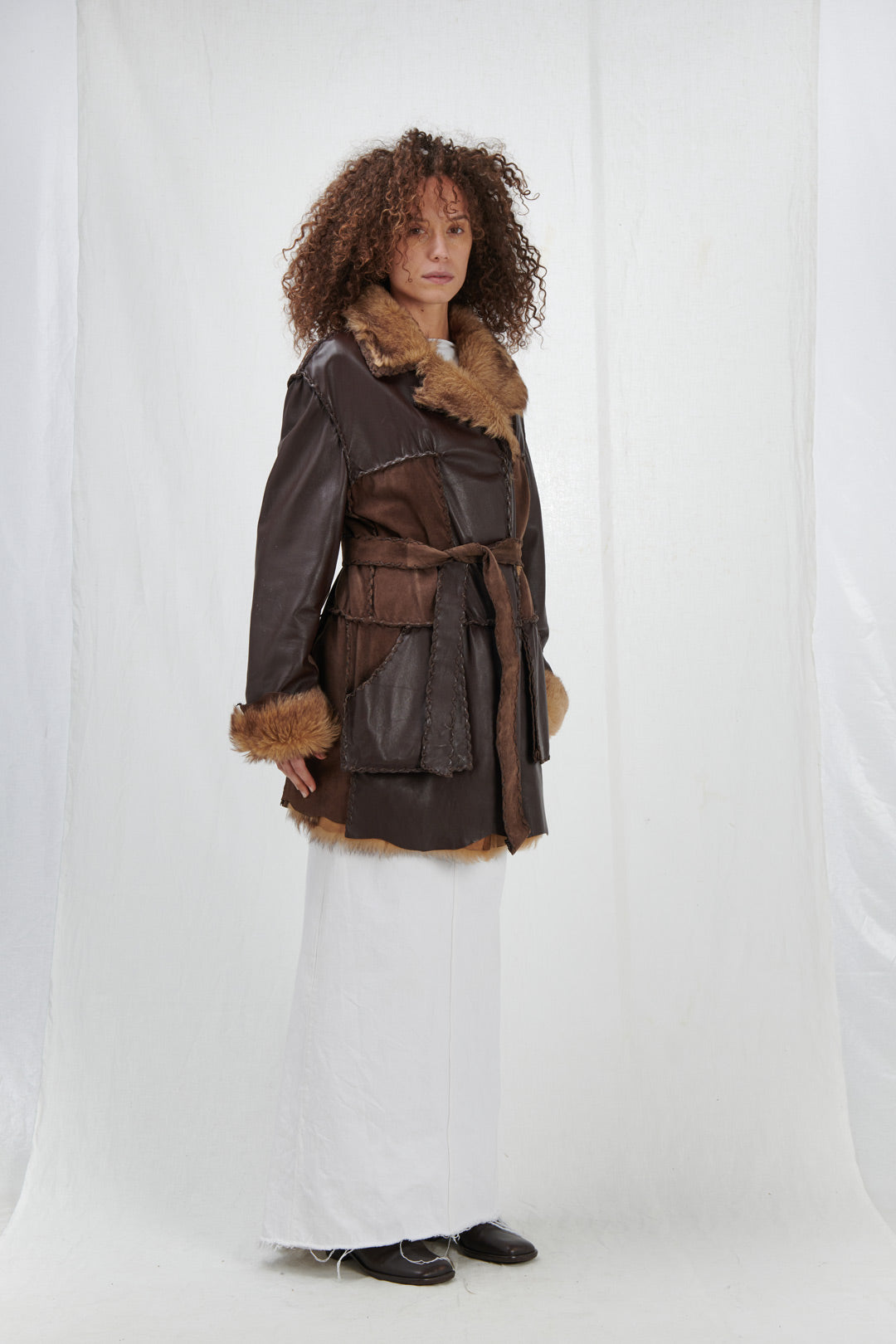 OUTERWEAR IN BROWN LEATHER AND FUR