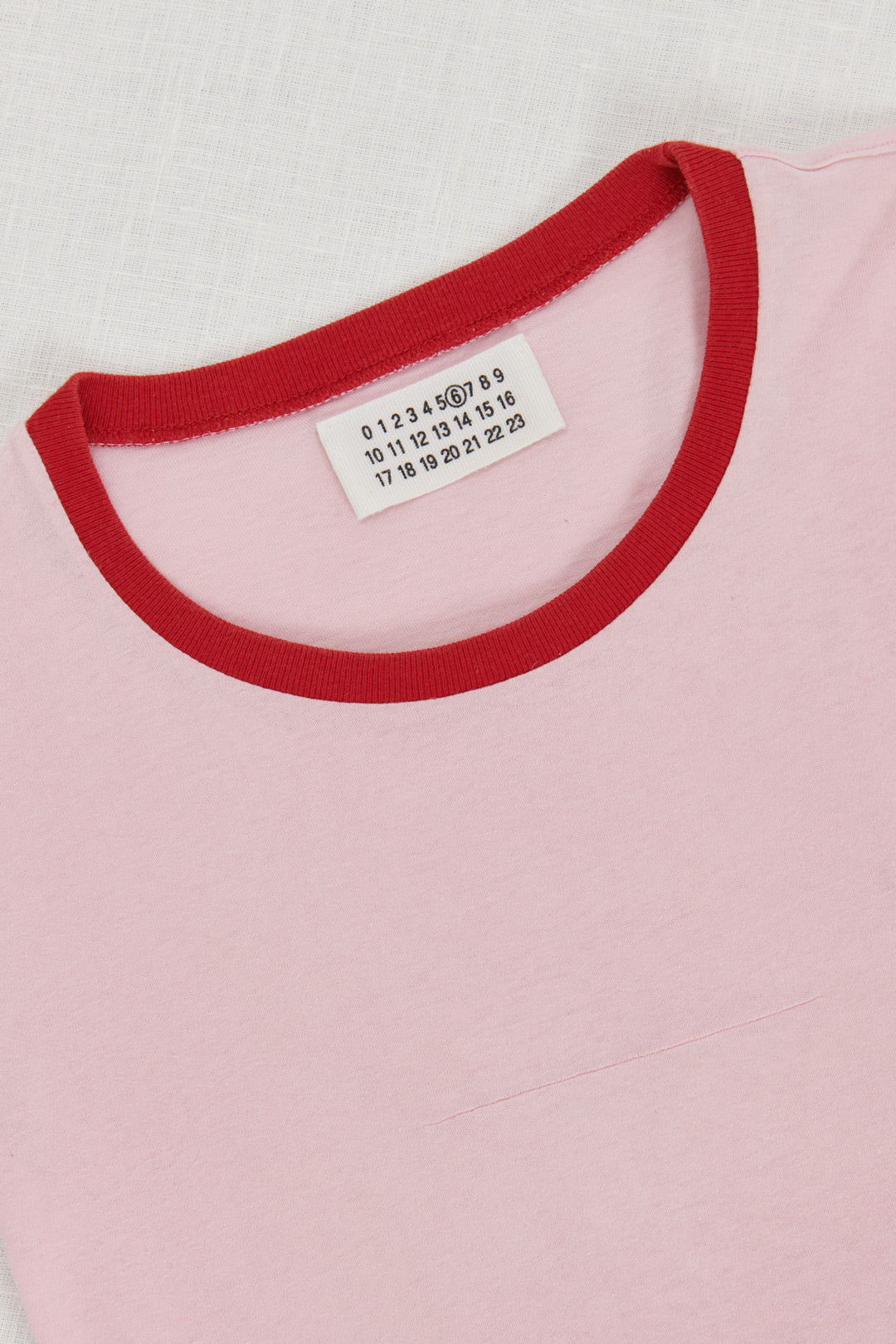 PINK T-SHIRT WITH RED PROFILES