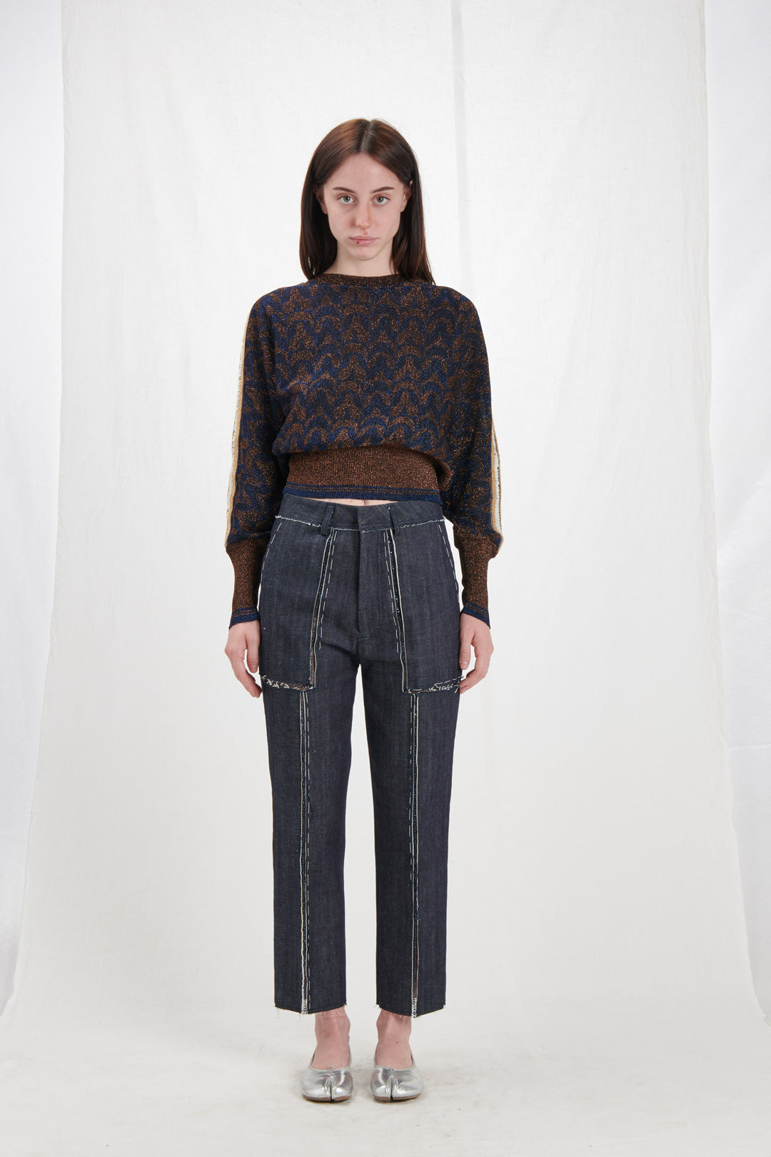 JEANS WITH CUTS AND SEQUINED DETAILS