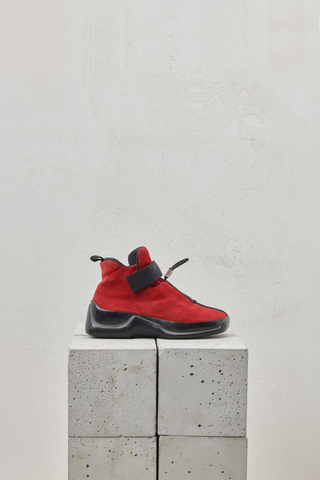 Red suede sneakers with one-piece rubber sole