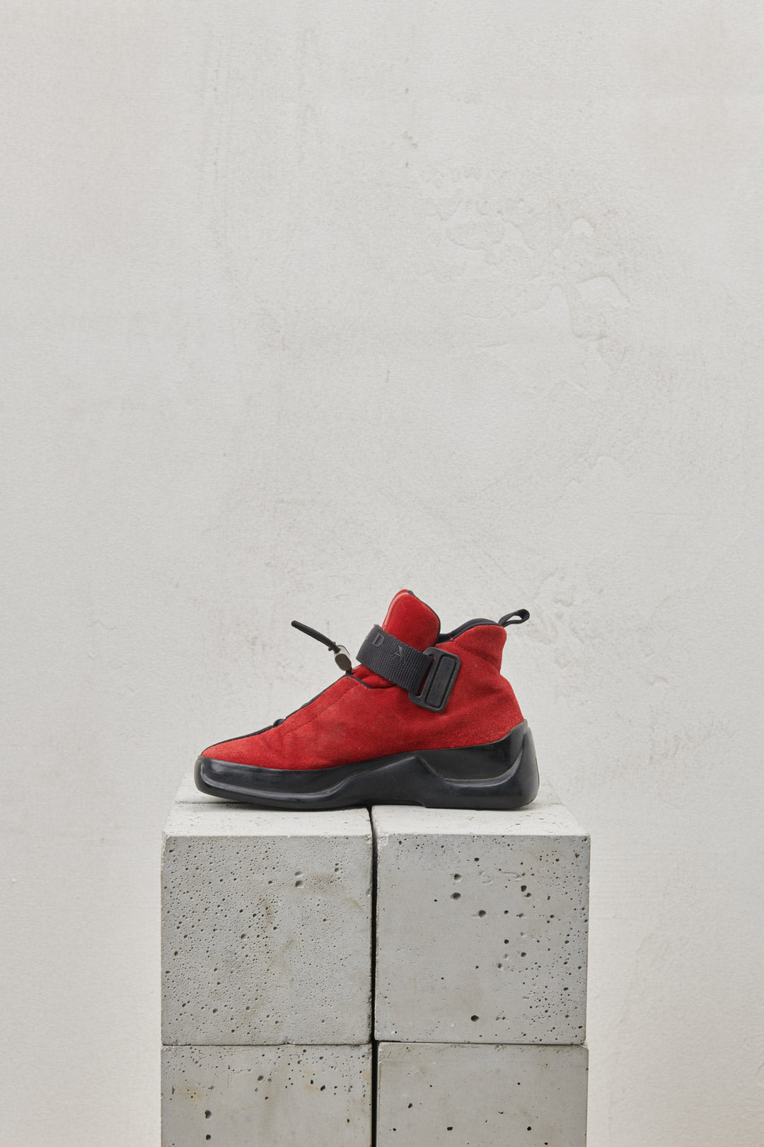 Red suede sneakers with one-piece rubber sole