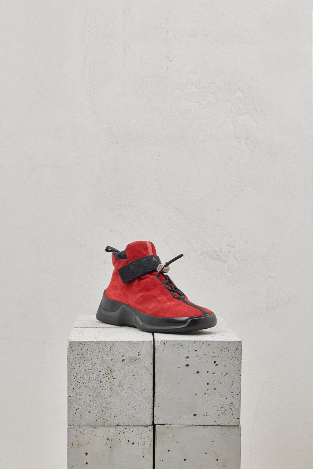 Red suede sneakers with one-piece rubber sole