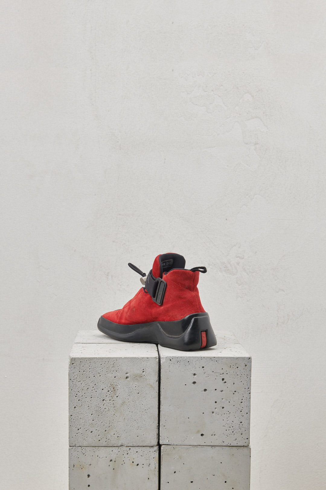 Red suede sneakers with one-piece rubber sole