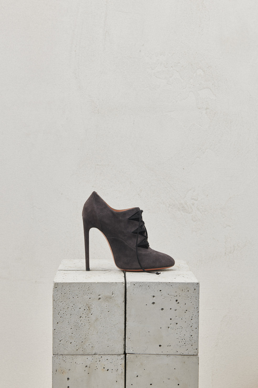 Gray suede lace-up ankle boot with stiletto heel