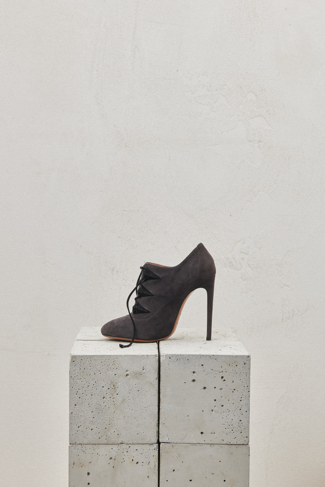 Gray suede lace-up ankle boot with stiletto heel