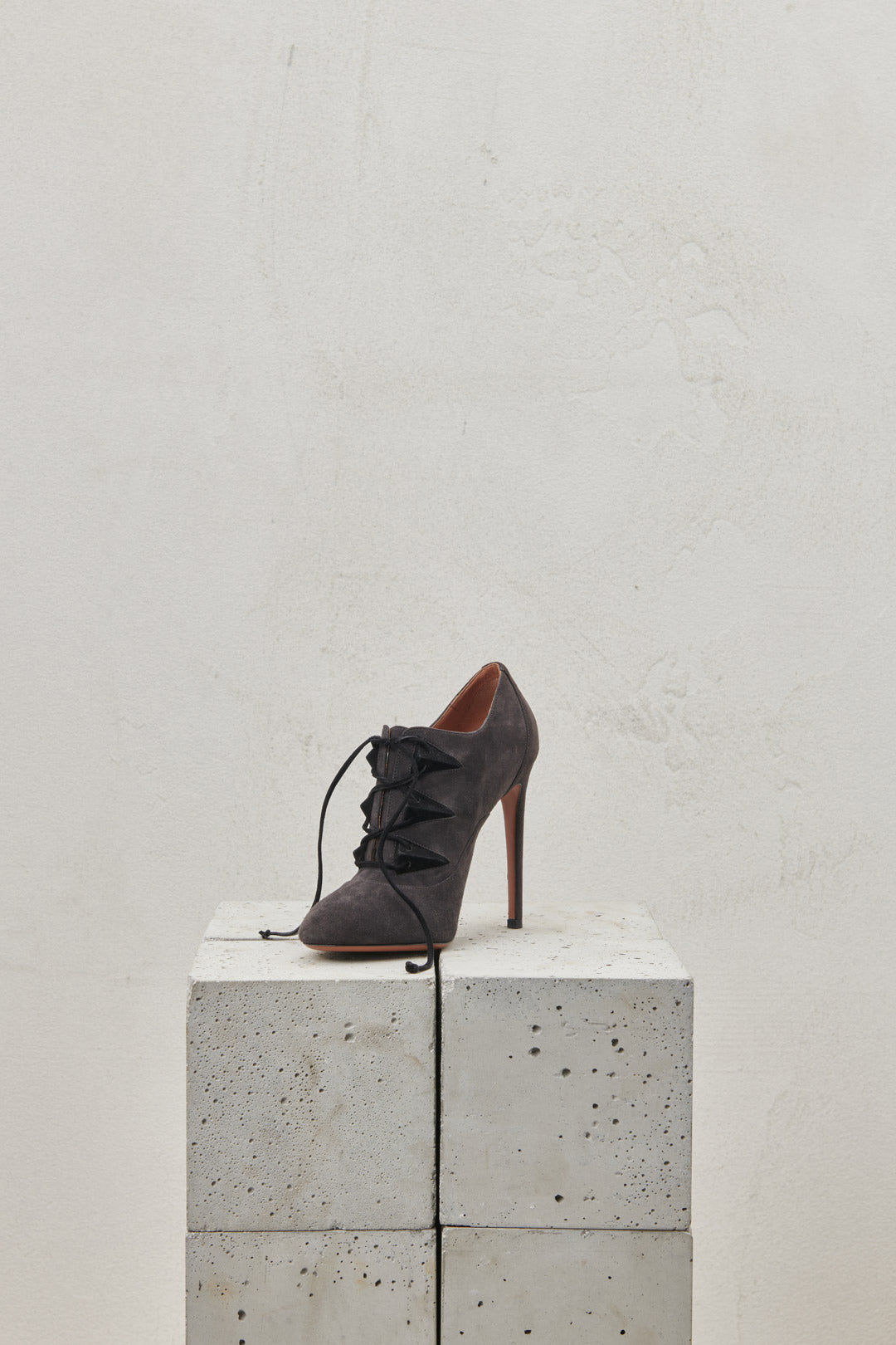 Gray suede lace-up ankle boot with stiletto heel