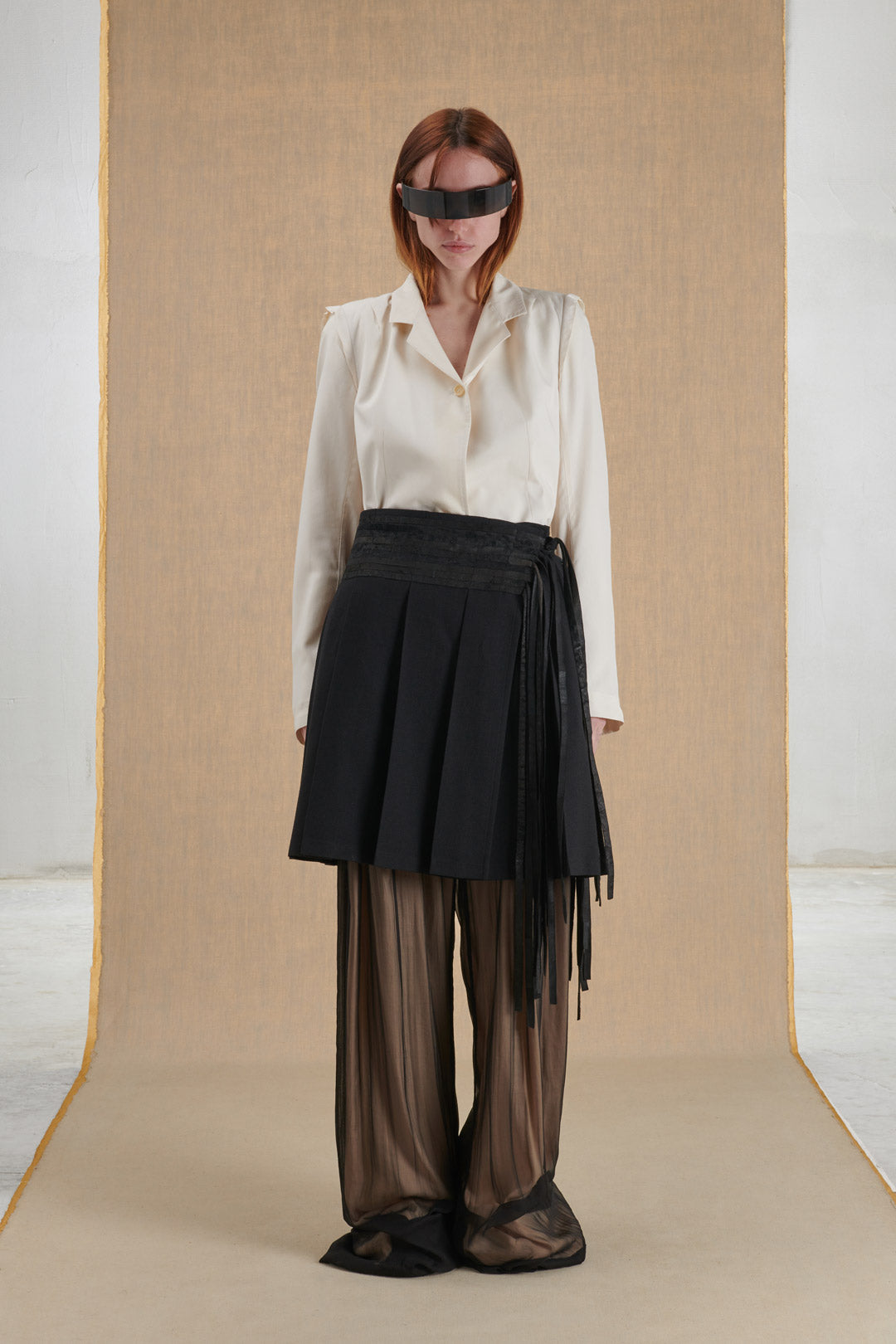 Pleated skirt in wool and leather