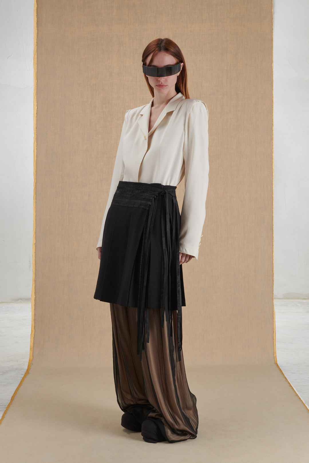 Pleated skirt in wool and leather